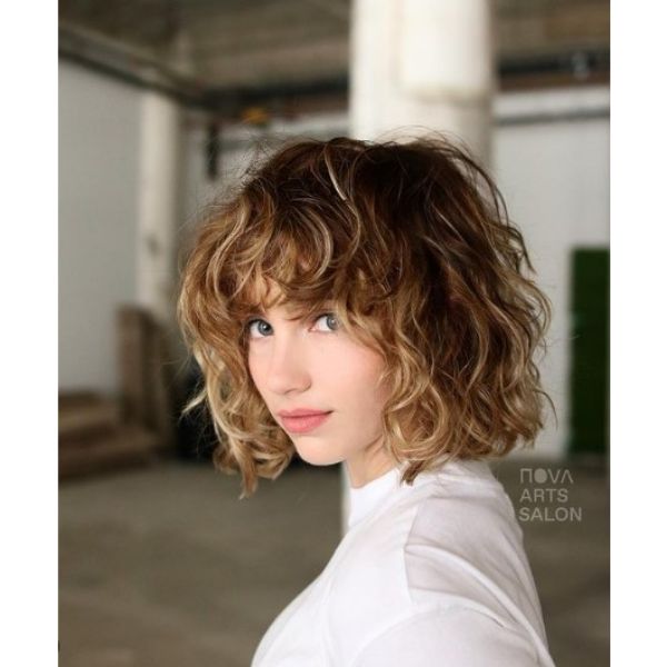 Curly Wavy Bob With Blonde Highlights And Curly Bangs