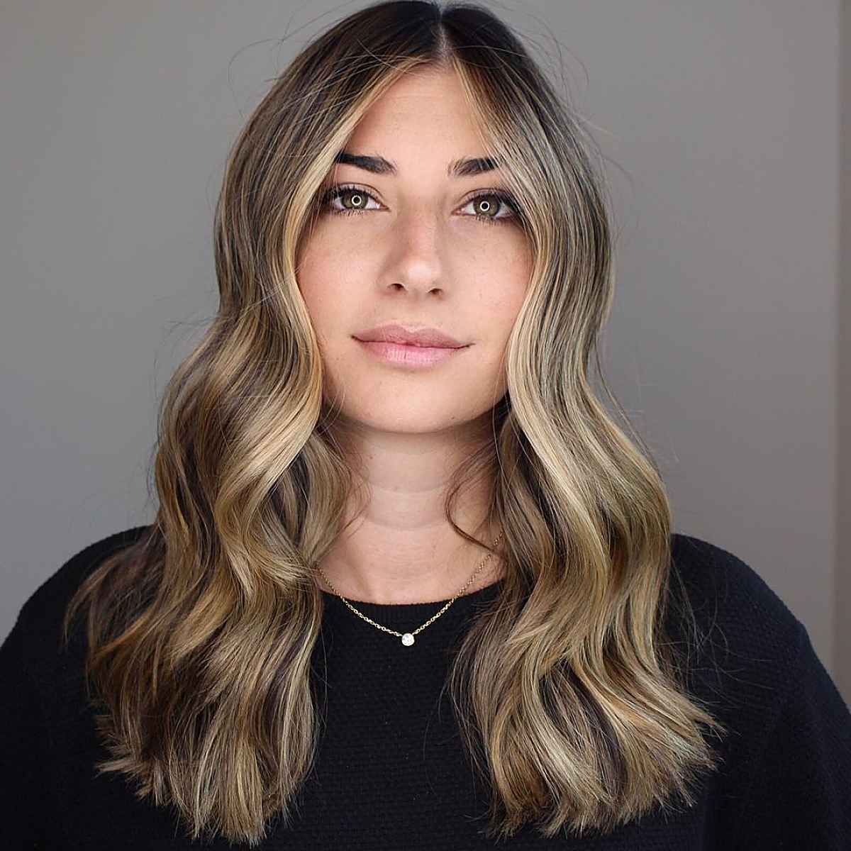 dark hair with dark blonde balayage highlights