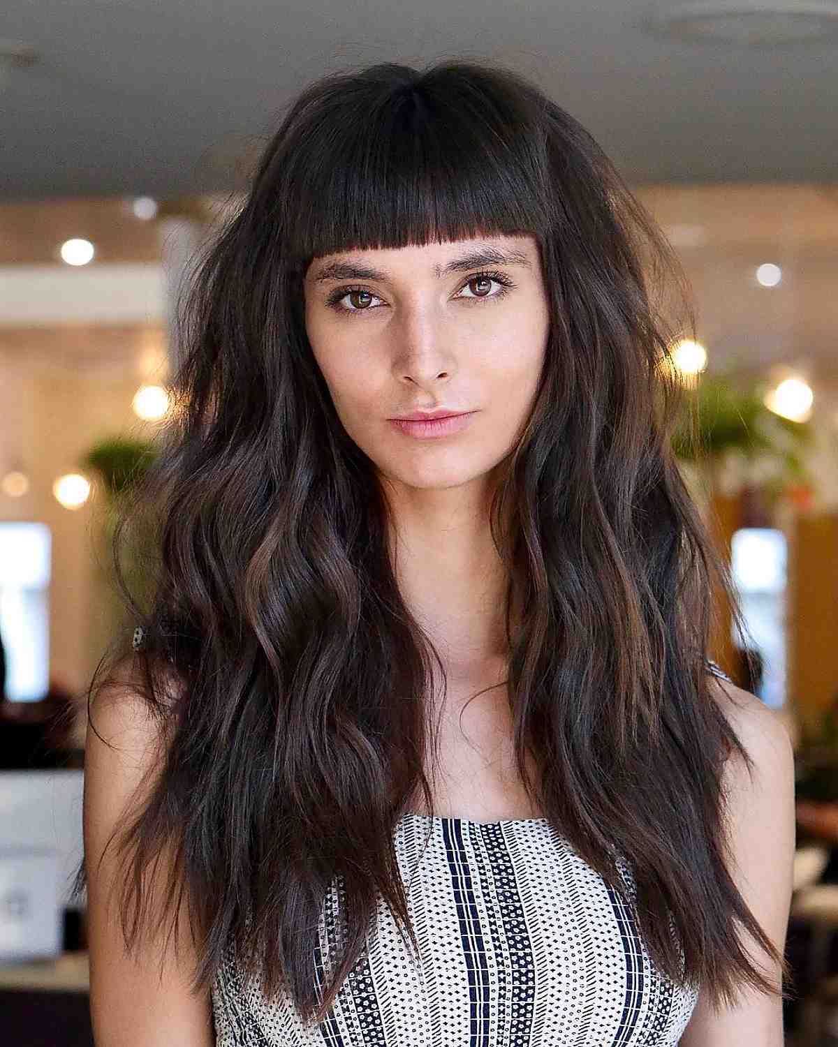 dark log hair with blunt bangs