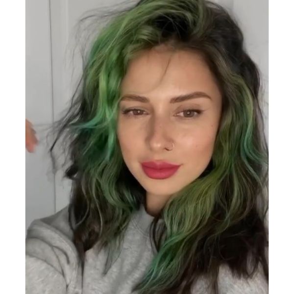 Dark Medium Haircut With Green Highlights And Messy Curls