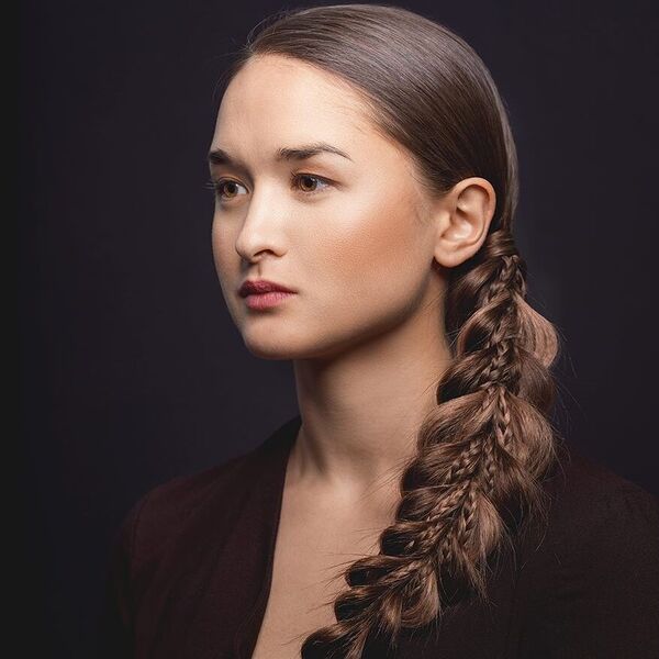 Dragon Tail Braid - a woman with brown eyes