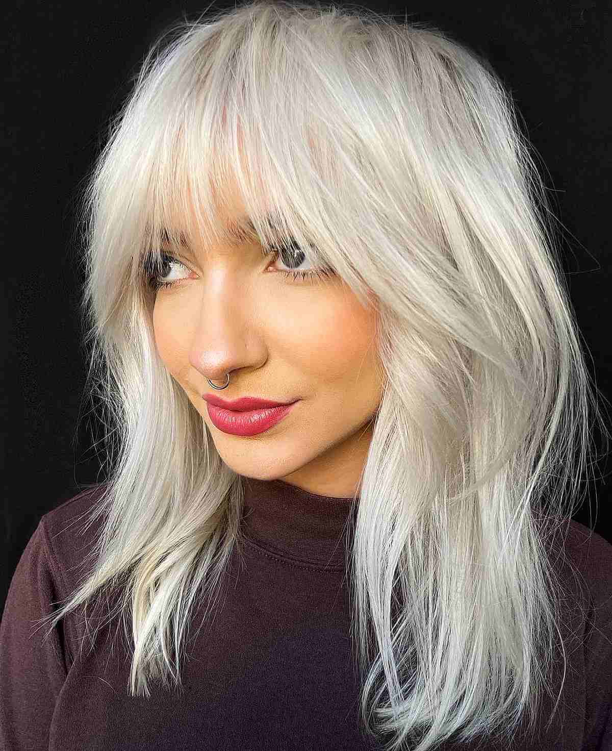 Dramatic layered medium length hair with bangs