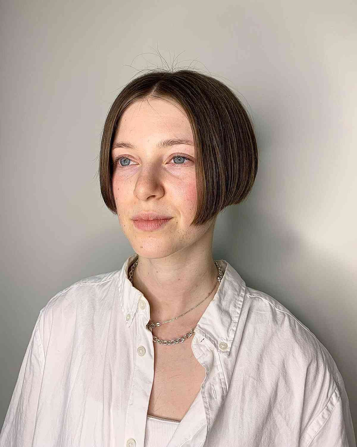 Ear-Length Bob with a Middle Part That is Above the Shoulders