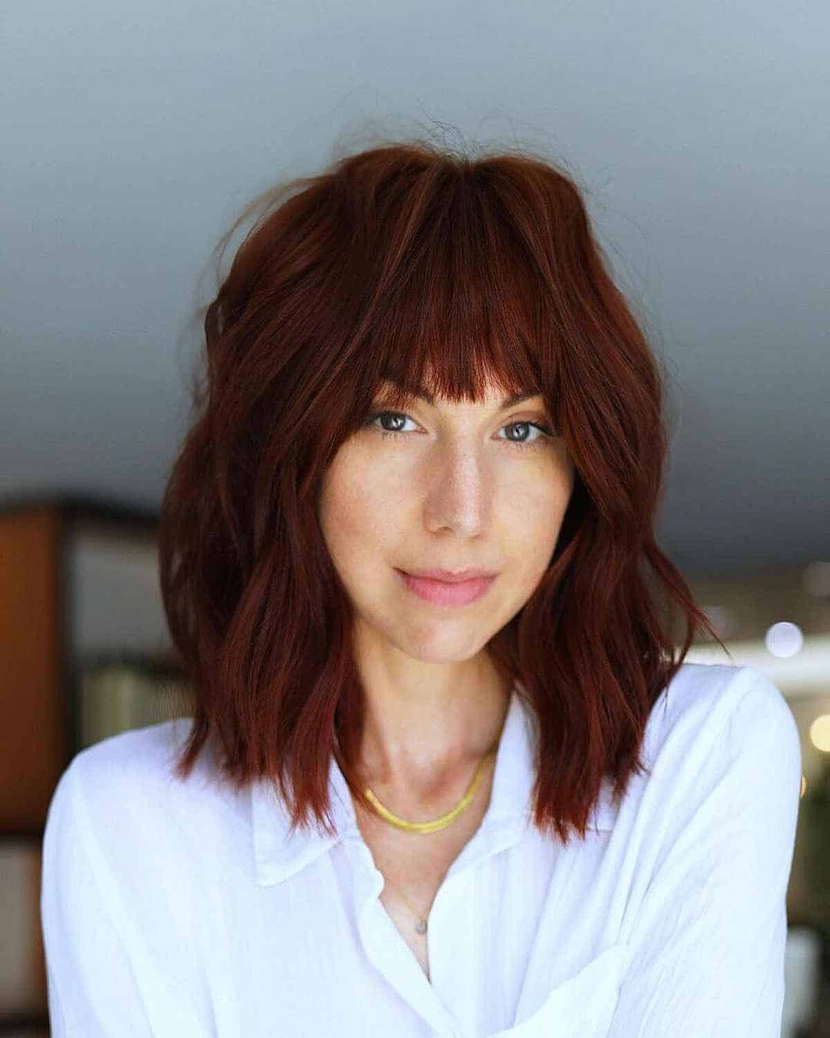 Effortless Collarbone-Length Dark Red Hair with Choppy Fringe