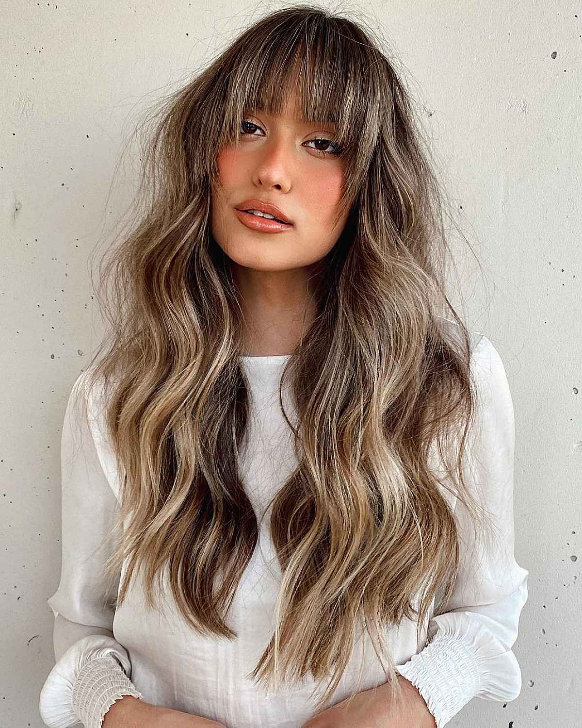 Face-Framing Bangs on Dimensional Blonde Hair