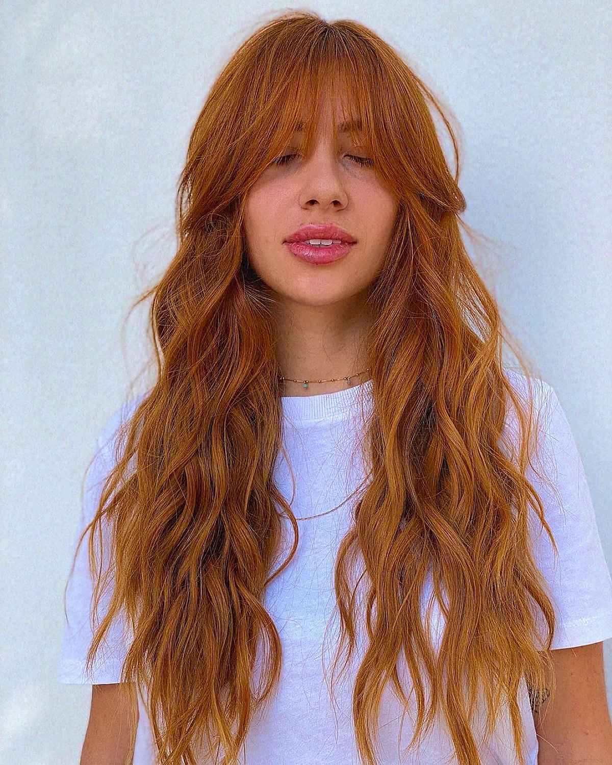 Face-Framing Wispy Bangs on Long Copper Hair