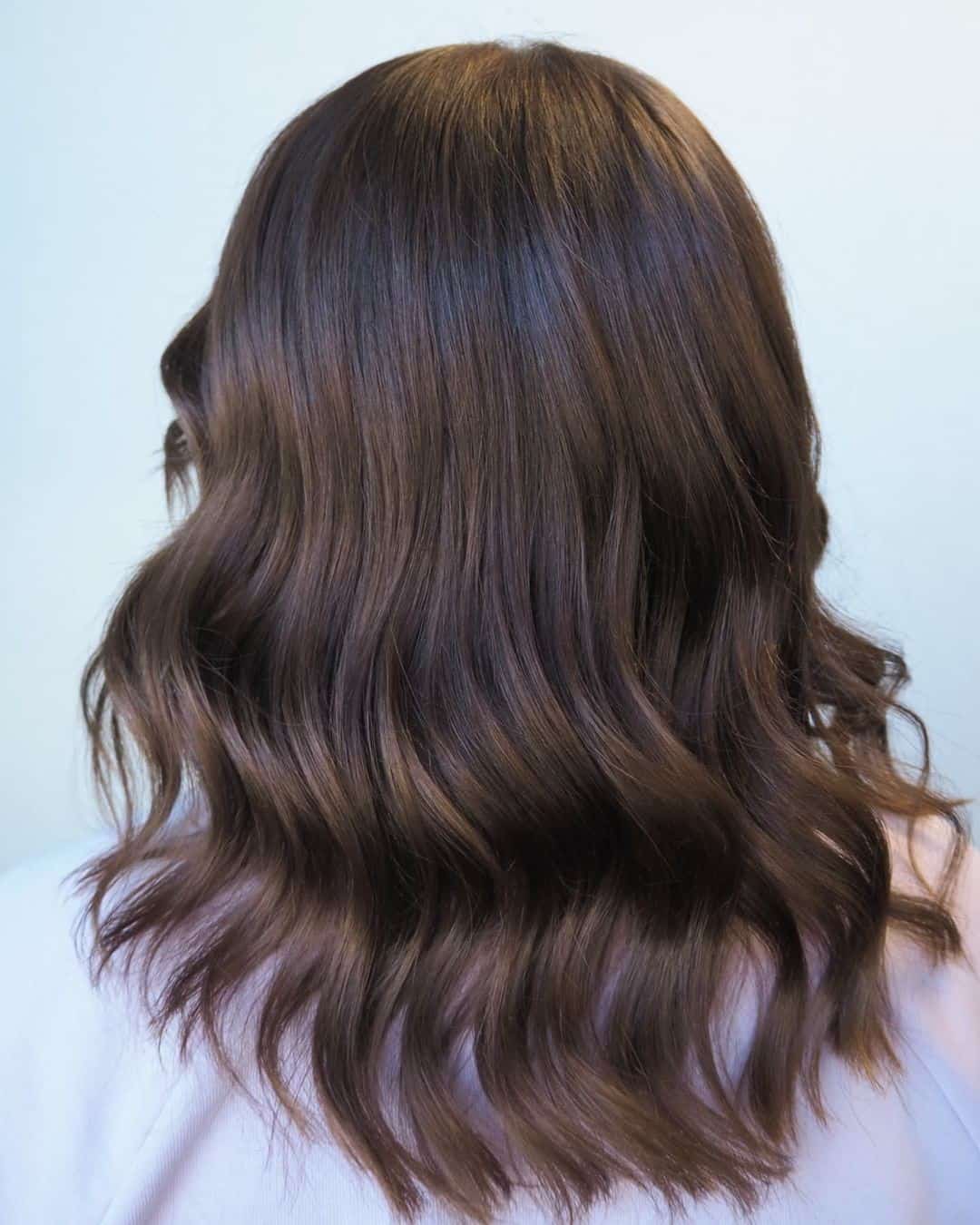 Feminine Flowy Brown Hairdo 