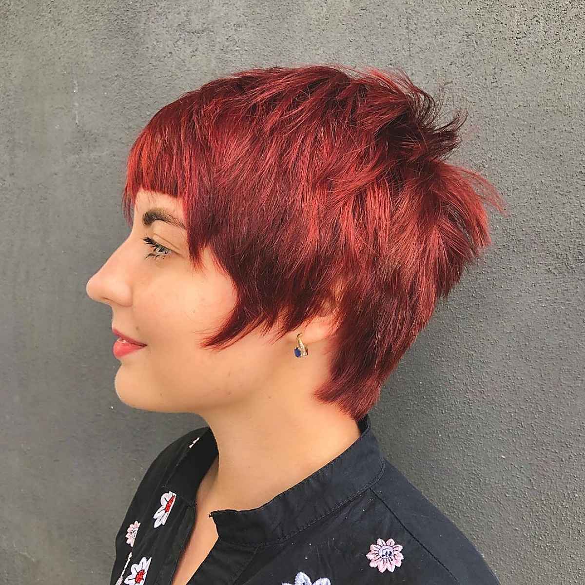 fiery red short hair with bangs for women with heart shaped faces