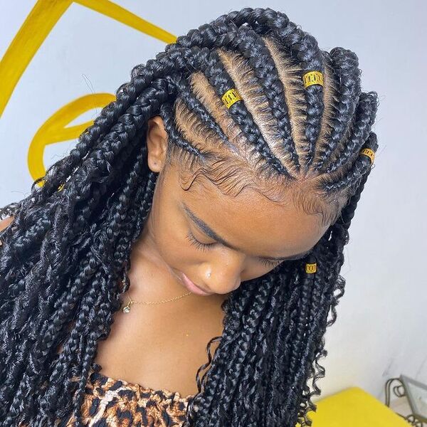 Goddess Braids - a woman wearing an animal printed top