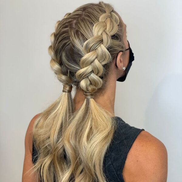 Half Braided Ponytails - a woman wearing a black facemask