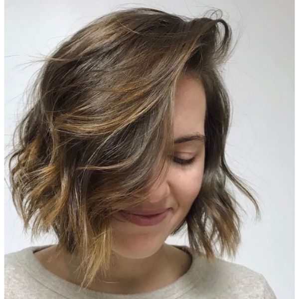 Honey Colored Medium Haircut For Wavy Hair With Deep Side Part