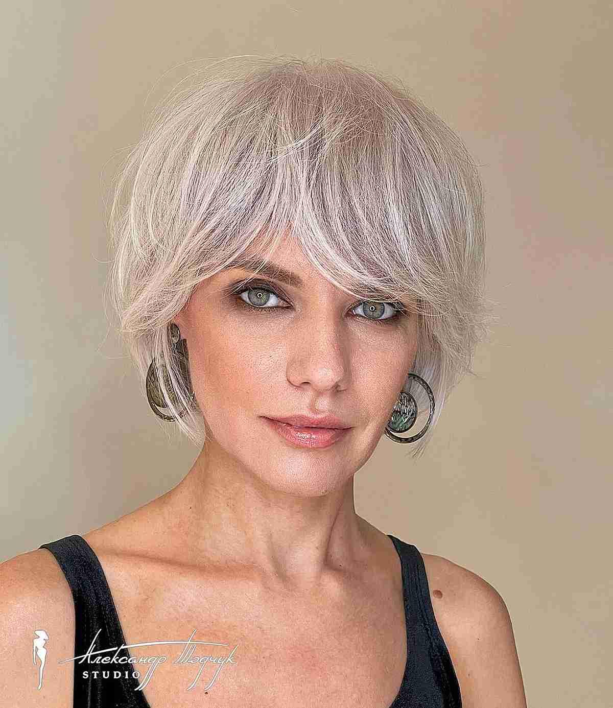 Jaw-Length Feathered Bob and Bangs for Women Over 40