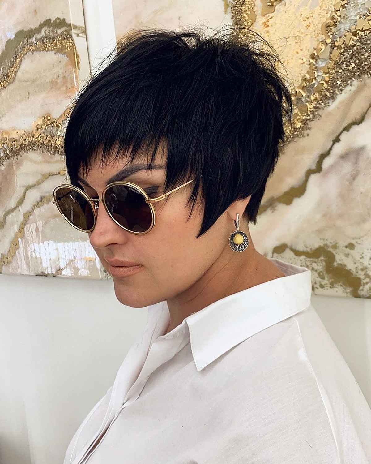 jet black long pixie cut with side burns