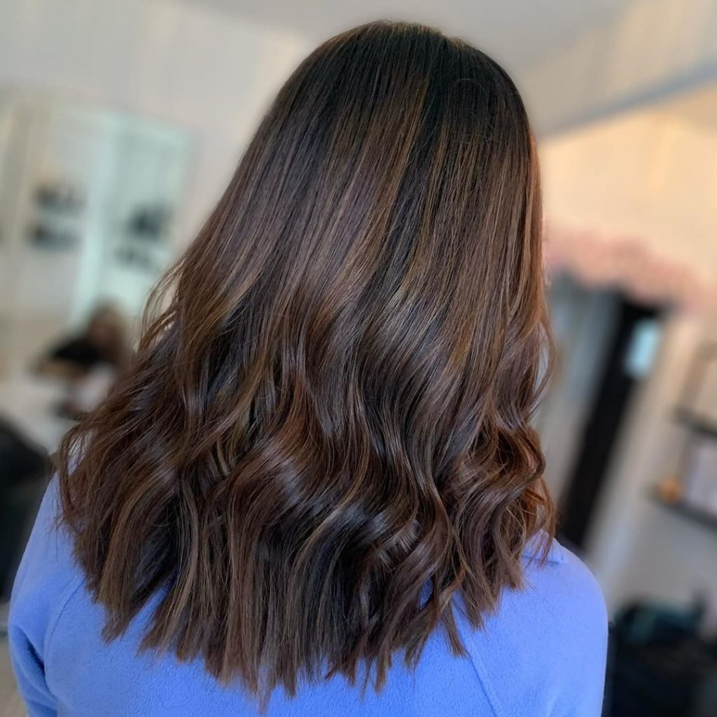 Long Brown hair with soft curls and subtle balayage