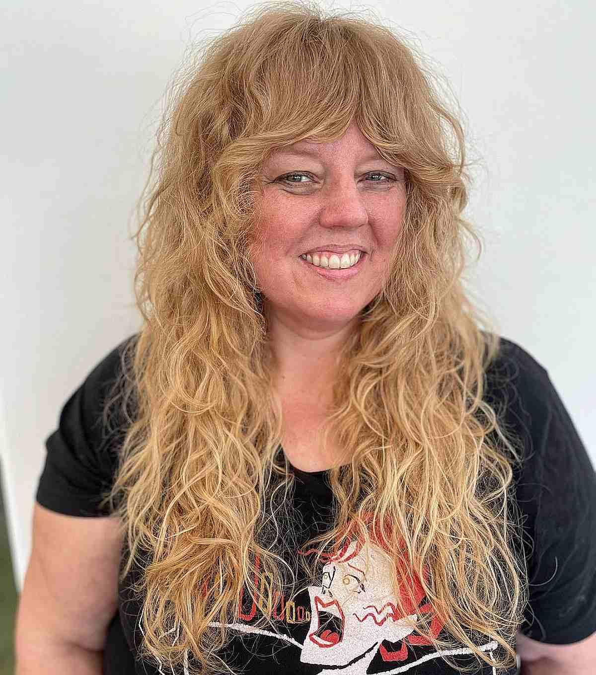 Long Curly Shag with Feathered Bangs on Women Over 50
