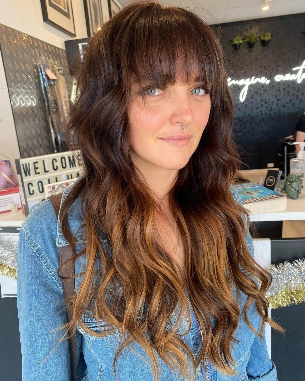 Long hair with subtle highlights and arched bangs