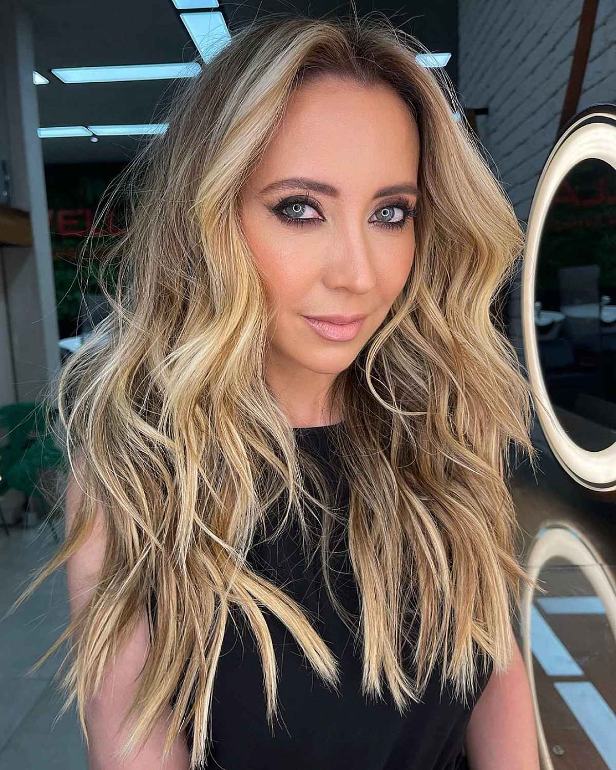 Long Wavy Layers with Blonde Face-Framing Pieces