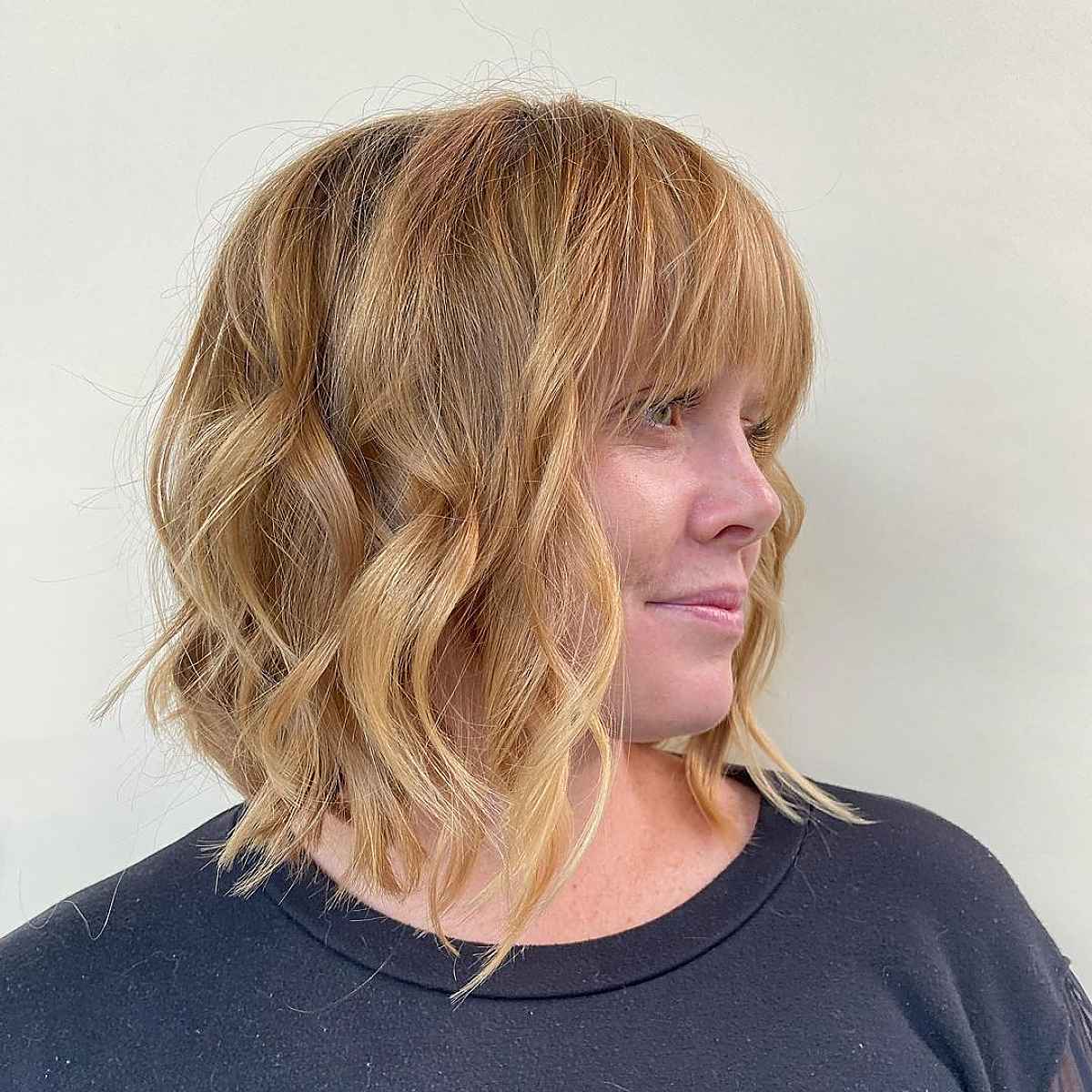 Medium-Length Wavy Bob with Bangs