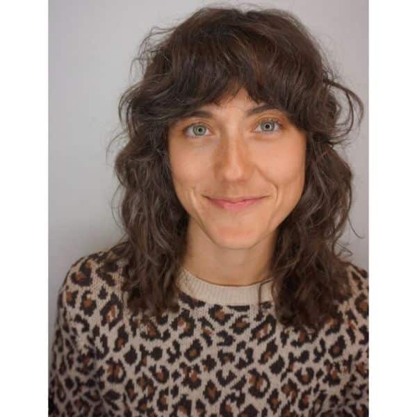 Medium Shag Haircut with Curly Bangs And Messy Waves
