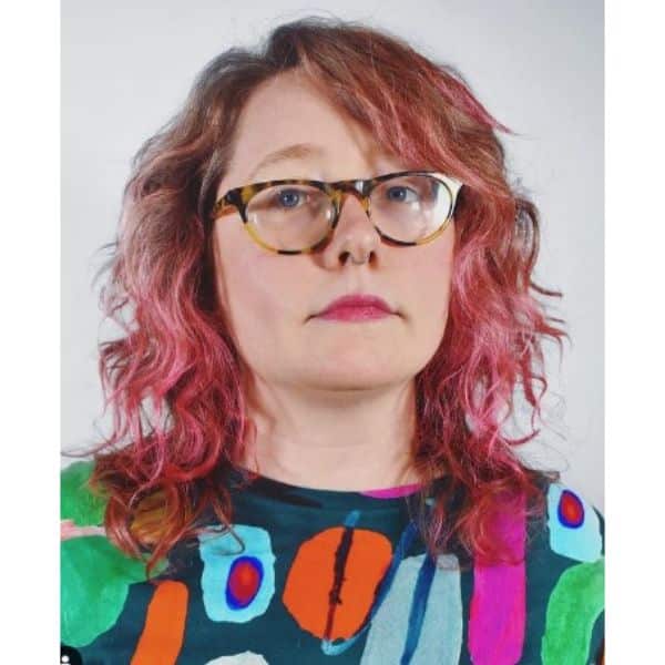 Medium Shag Haircut With Side Bangs and Red Pink Highlights