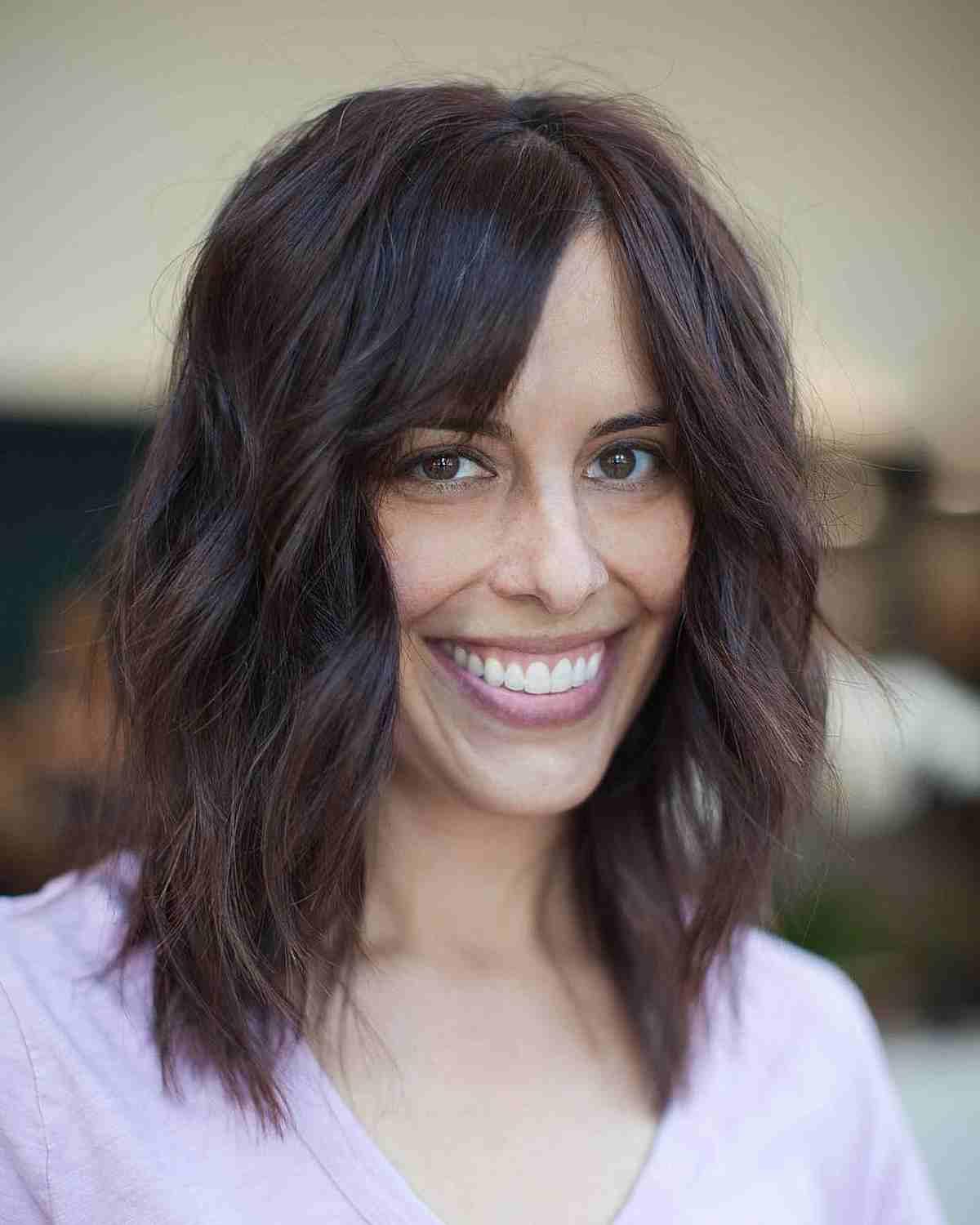 Medium Textured Haircut with Layers and Beach Waves and Side Bangs