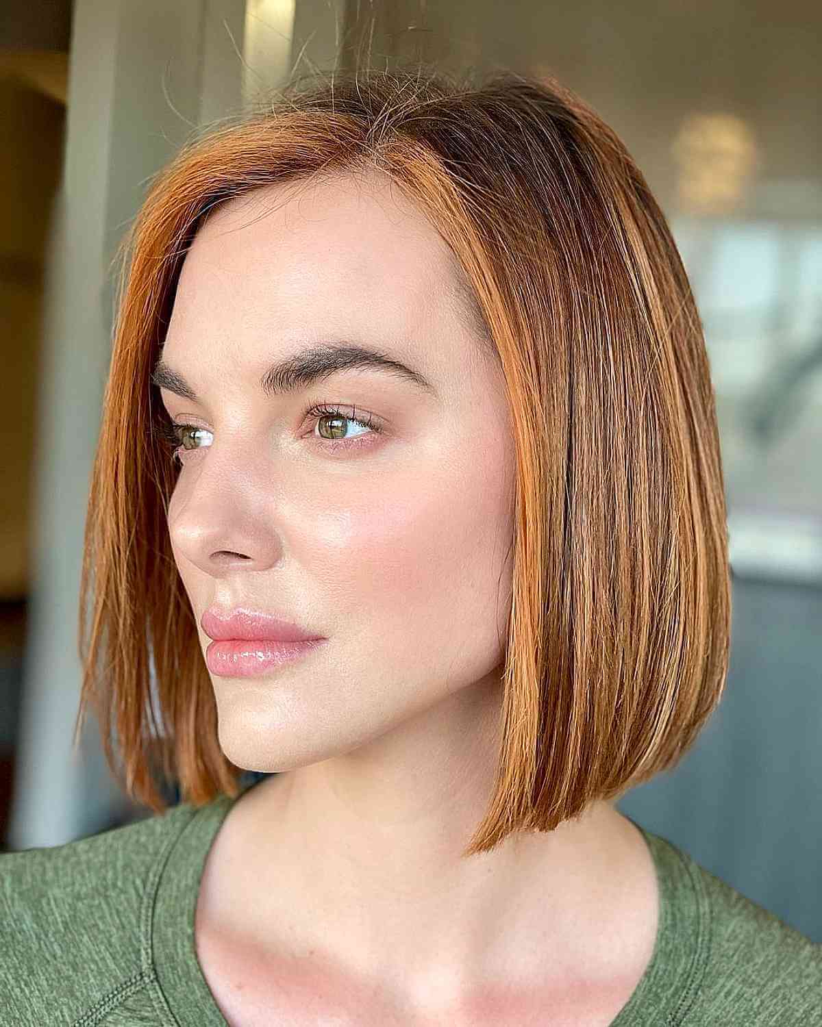 Medium to Short Auburn Bob with Face-Framing Highlights