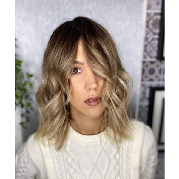 Medium Wavy Haircut With Subtle Baby Lights