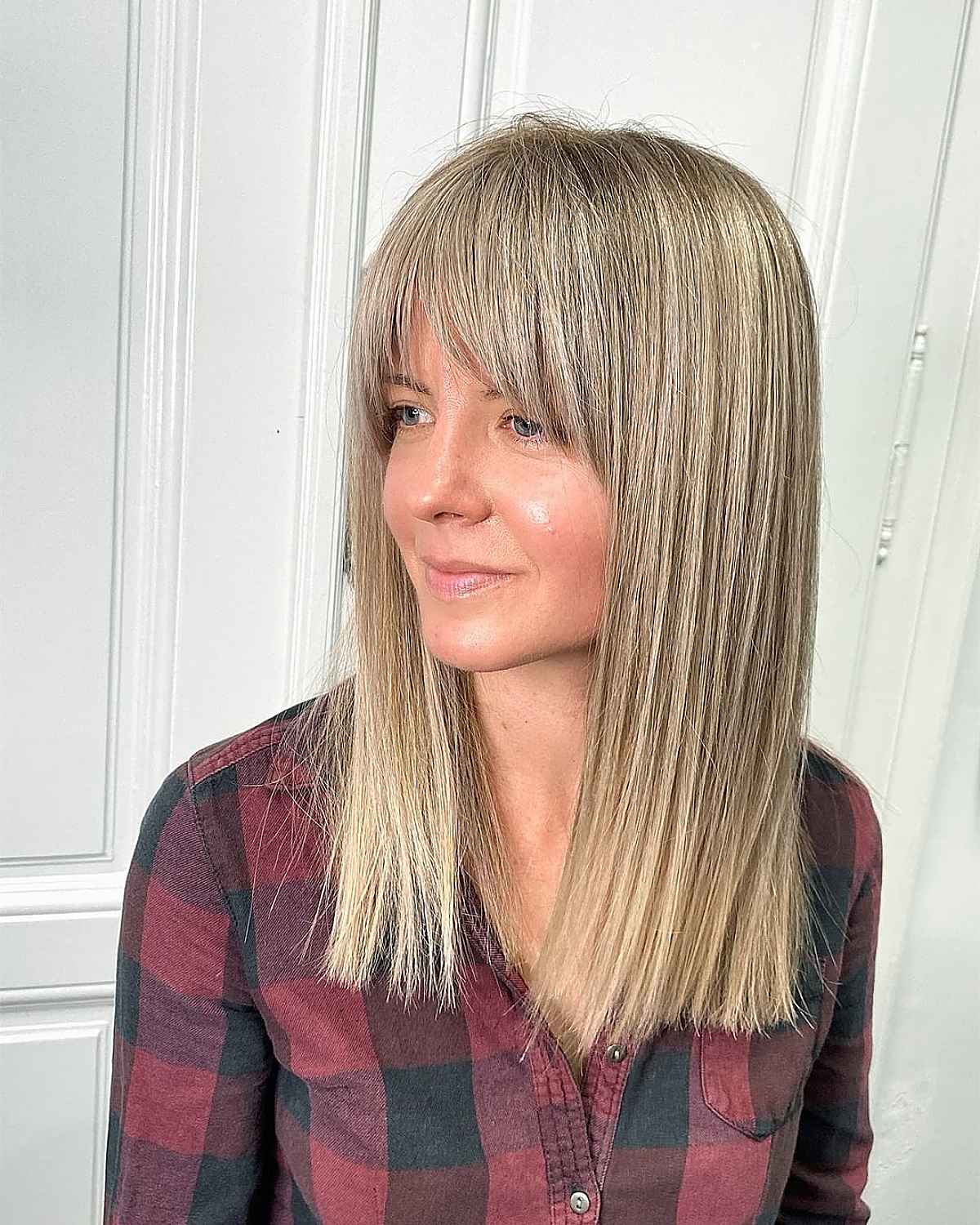 Mid-Length Blunt Cut with a Curtain Fringe