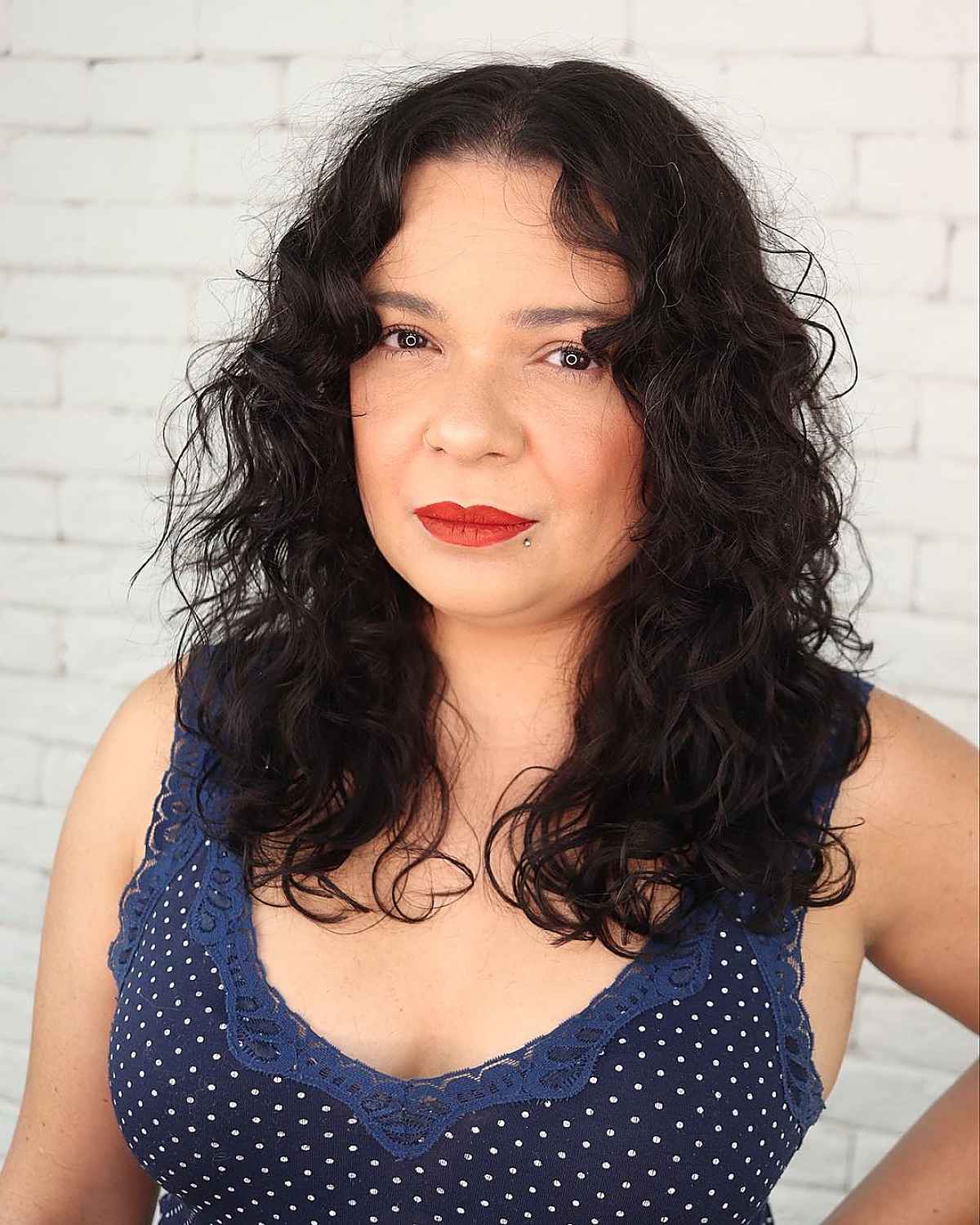 mid-length curly shag for dark hair