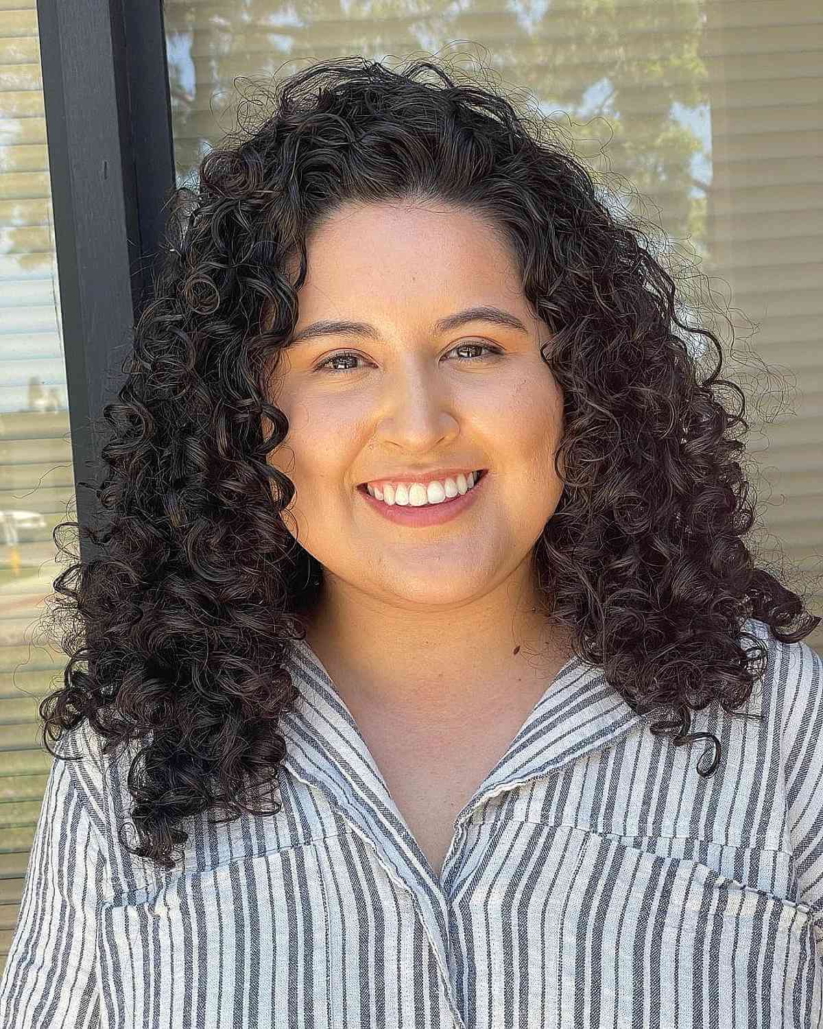 Mid-Length Curly Shag for Round Faces