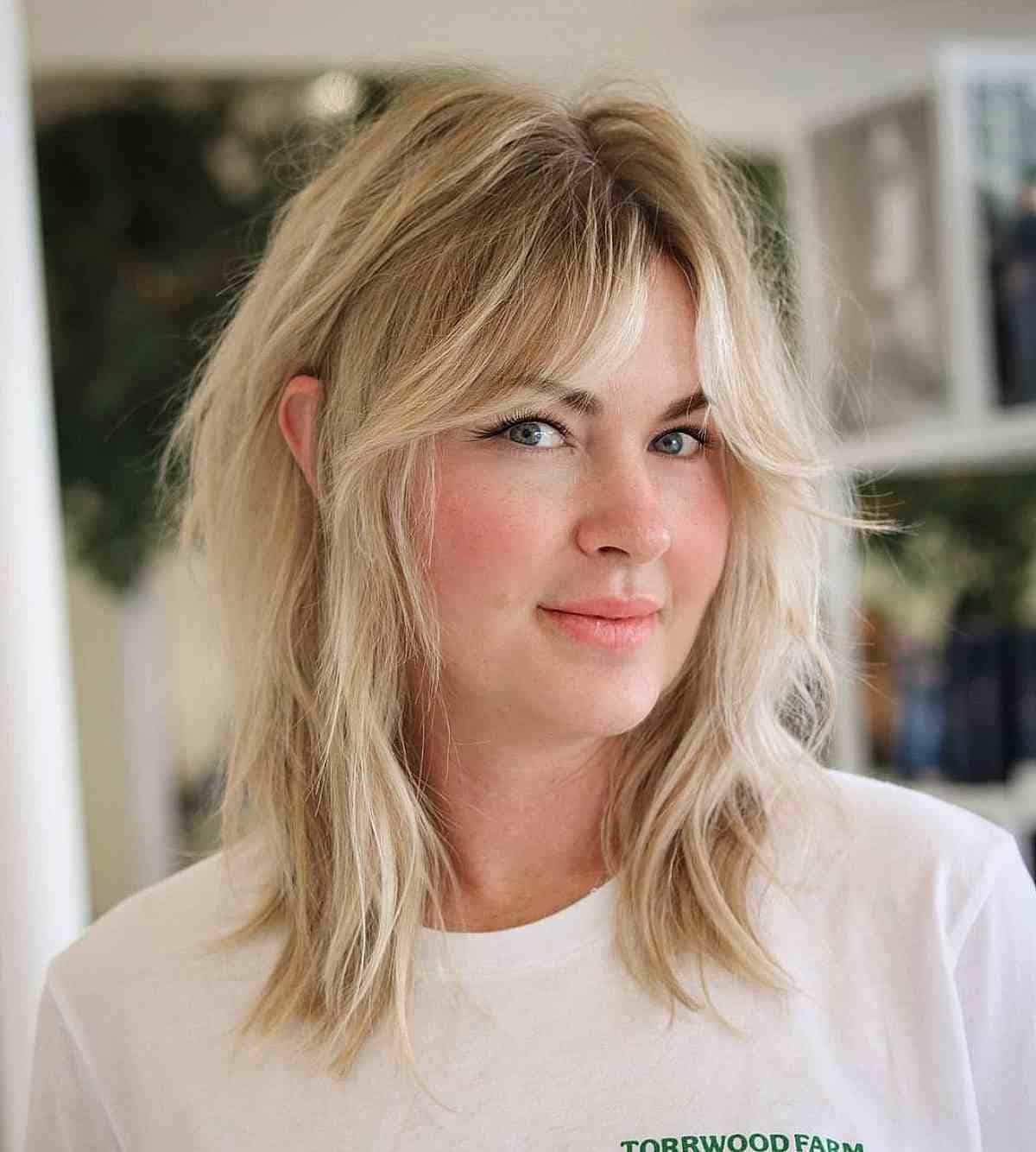 Mid-Length Disheveled Blonde Shag with Curtain Fringe