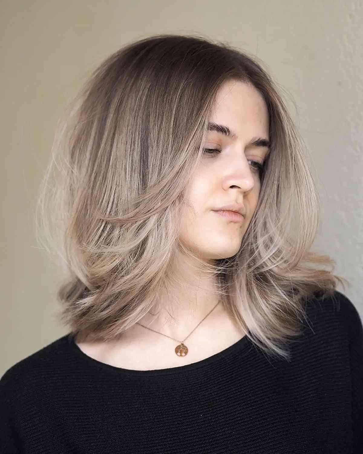 Mid-Length Middle Part Hairstyle with Front Layers