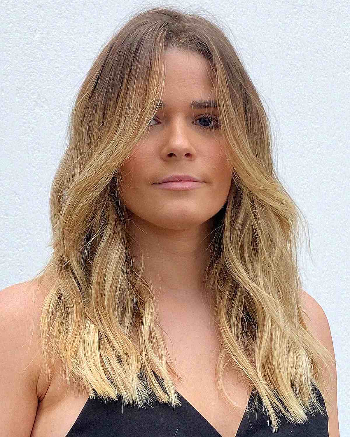 Mid-Length Modern Blonde Waves with Face-Framing Layers