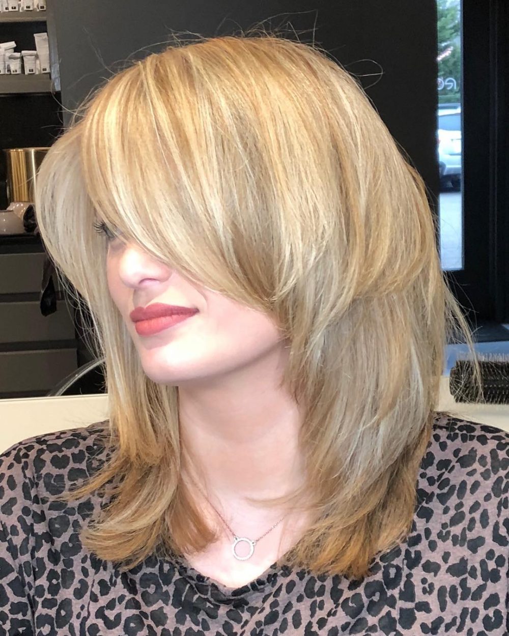 Mid-Length Razor Cut with Long Bangs and Short Layers