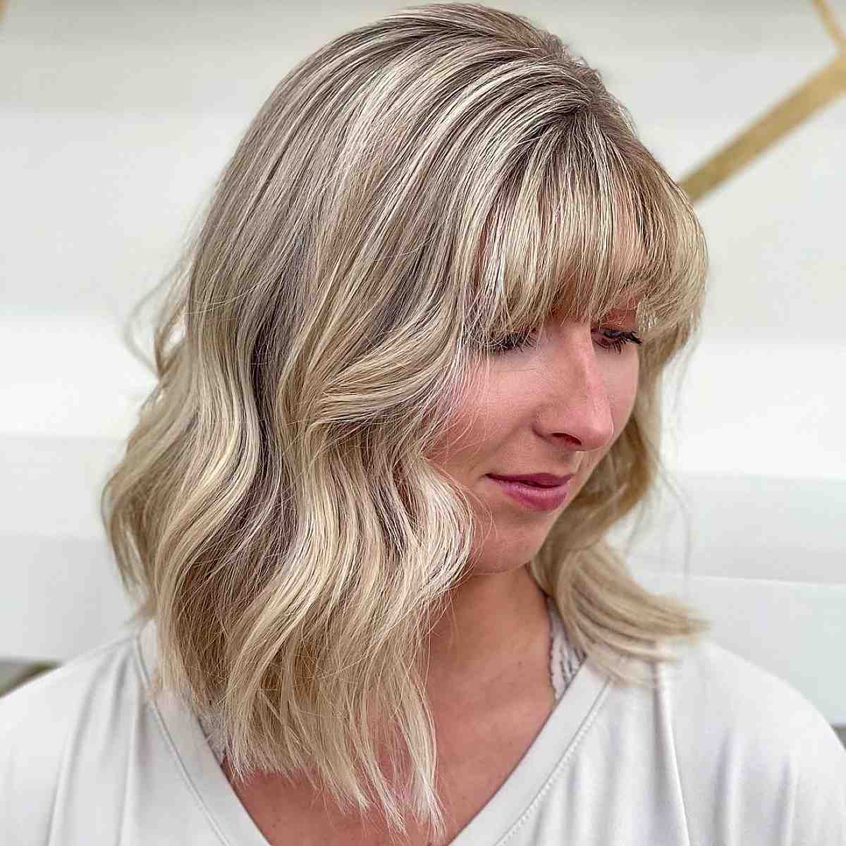 Mid-length wavy hair with bangs