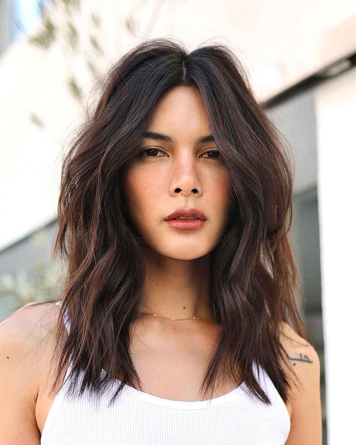 middle parted textured lob haircut