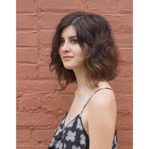 Modern Medium Shag Haircut For Wavy Hair with Side Part