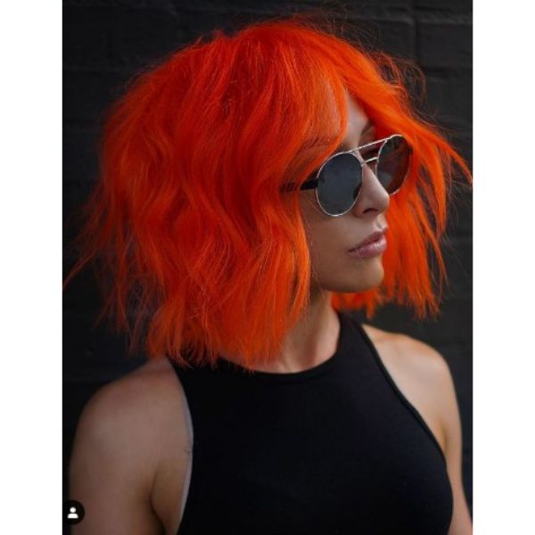Neon Orange Medium Haircut For Wavy Hair With Messy Texture