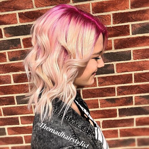 Picture of a bright pink rooted shoulder-length ombre
