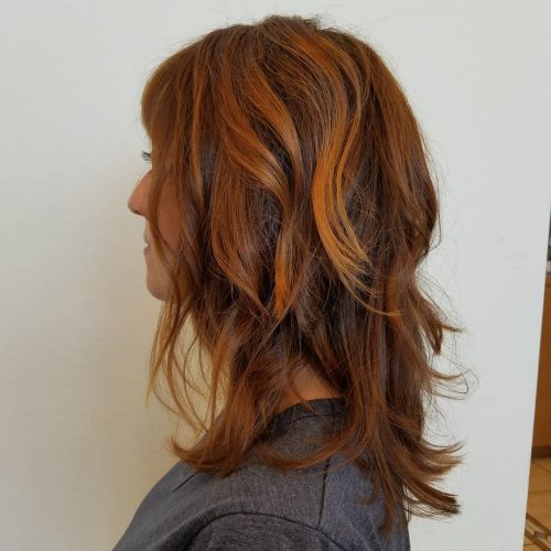 Picture of a textured chestnut shoulder-length hair