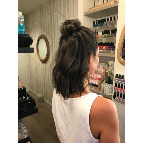 Picture of a trendy top messy bun shoulder-length hair