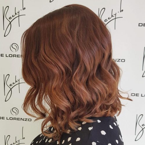 Picture of an attractive auburn shoulder-length hair color