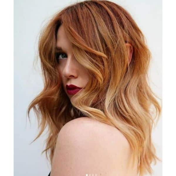 Red and Ginger Shades For Medium Wavy Shag With Long Bangs