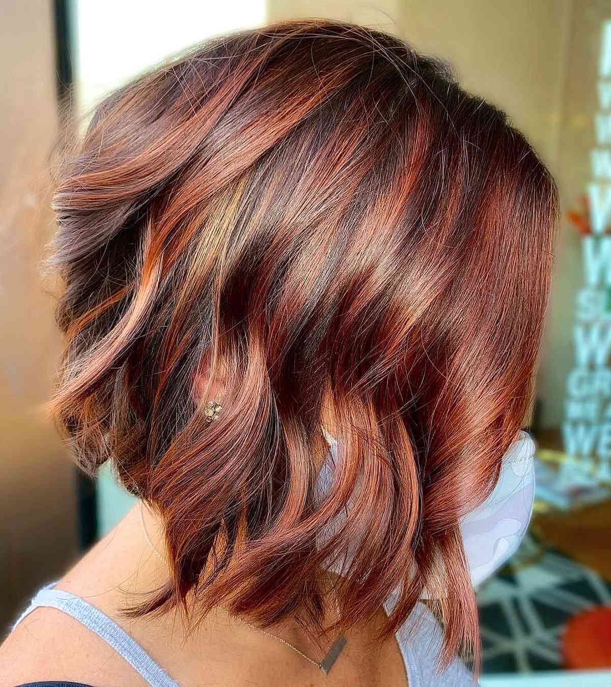 Short Angled Cut with Auburn Highlights