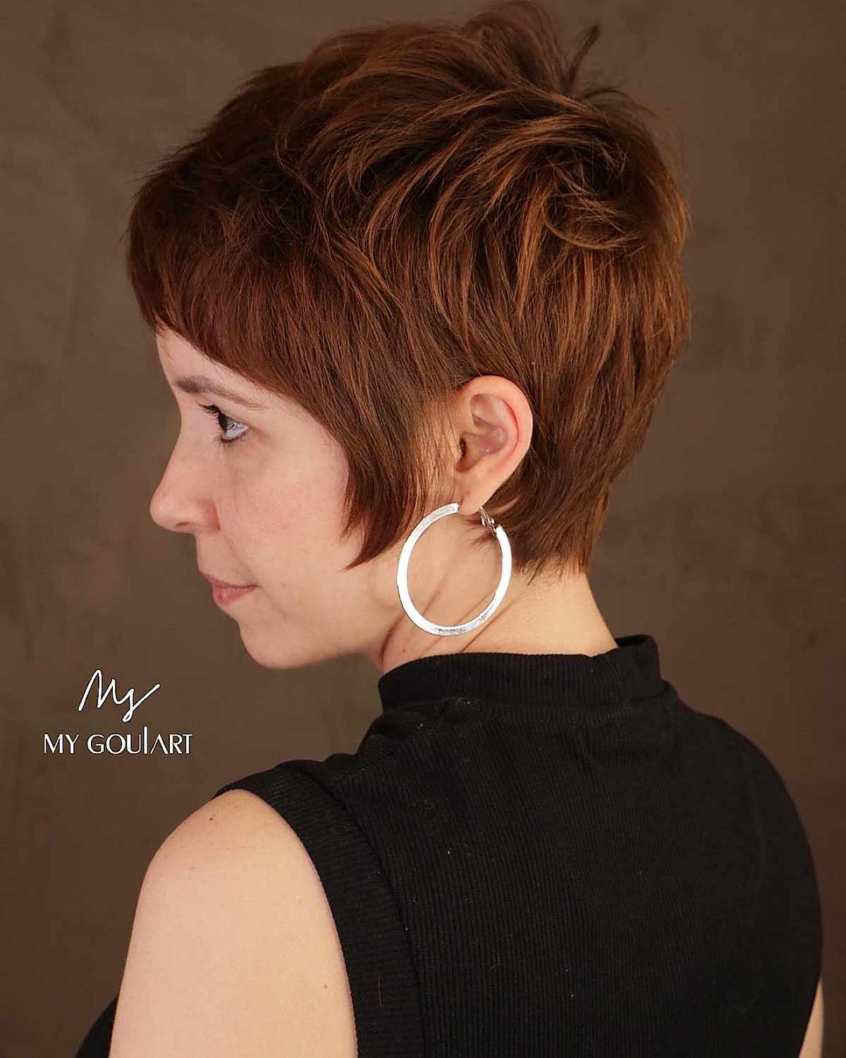 Short auburn red pixie cut