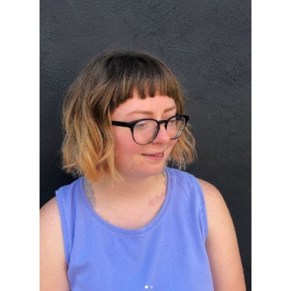 Short Curly Bob With Balayage And Rounded Bangs Hairstyle