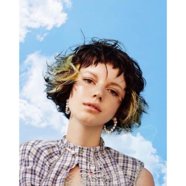 Short Curly Bob With Chopped Bangs Wih Blonde Highlights