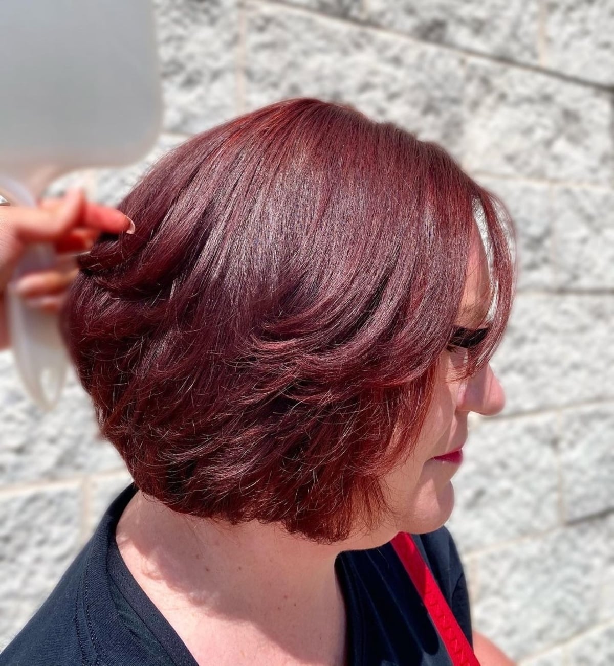 Short maroon-burgundy bob for women over 50