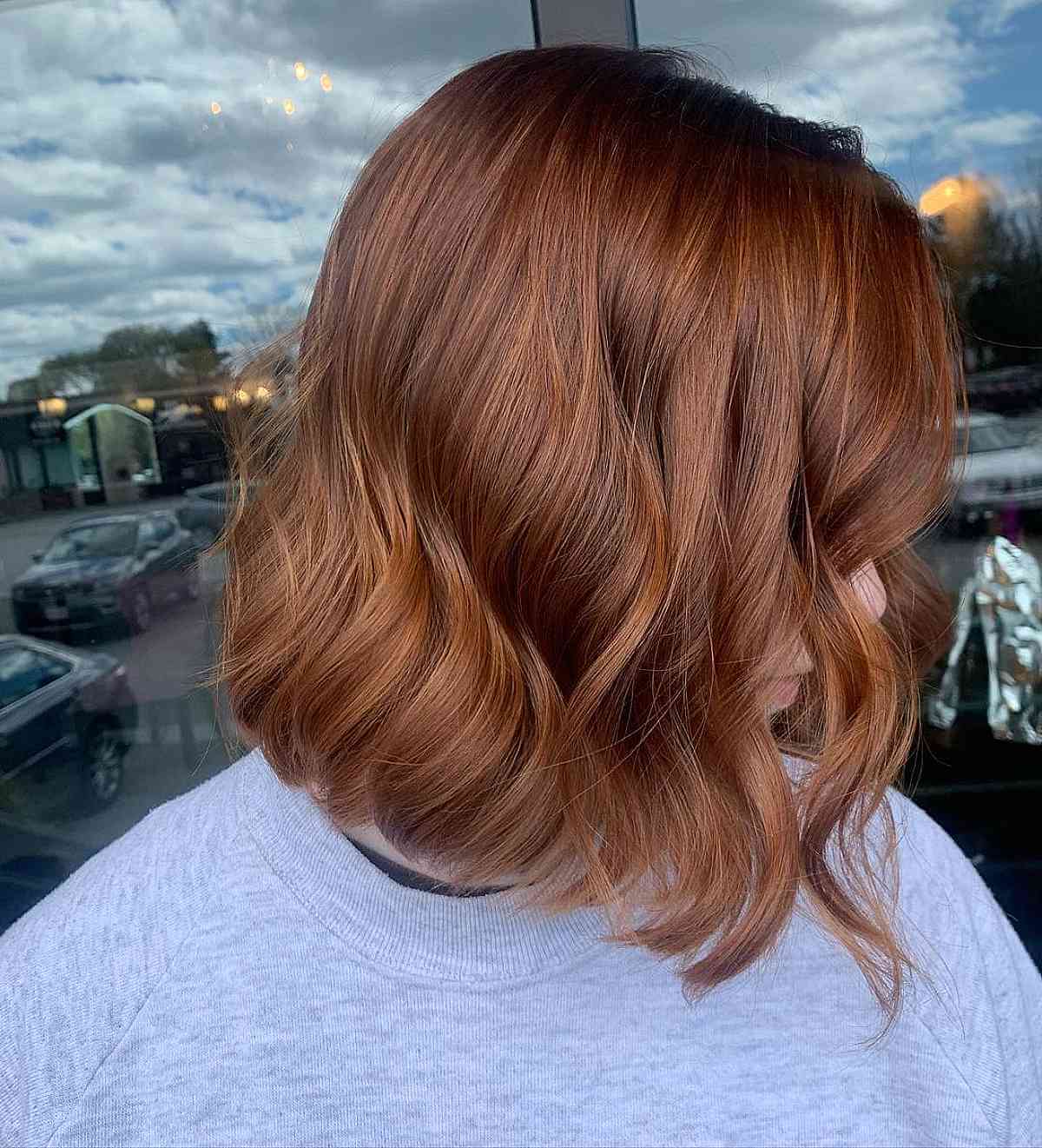 Short Wavy Hair with an Auburn Chestnut Hue