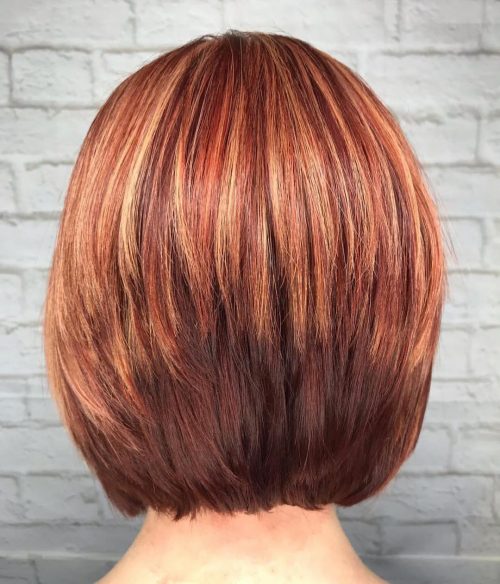 Shorter red hair with blonde highlights
